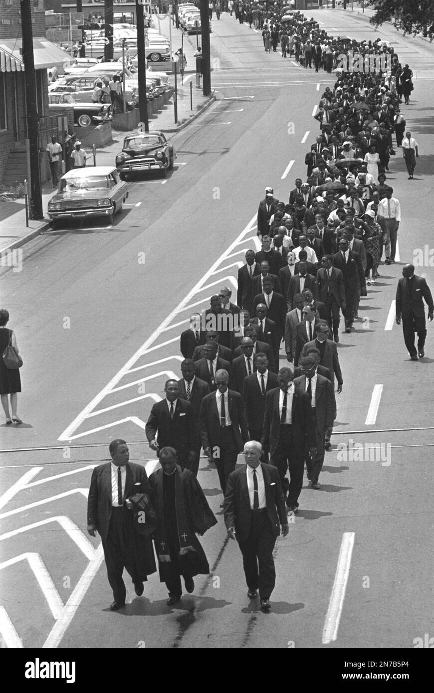 FILE In this June 15, 1963 file photo, mourners march to the Jackson, Miss., funeral home