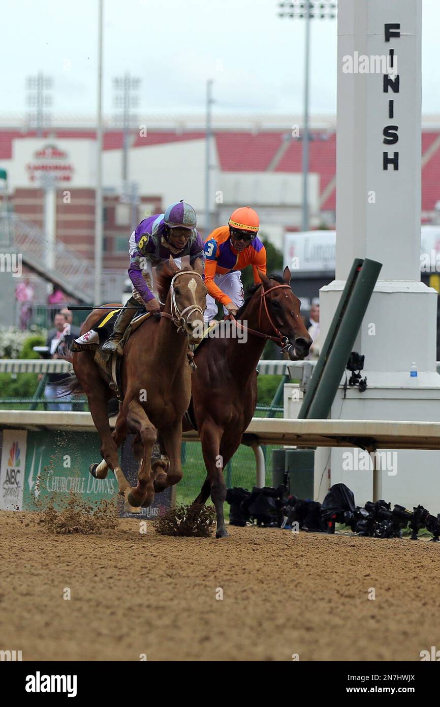 Jockey Mike Smith, outside, aboard Princess of Sylmar passes Garrett