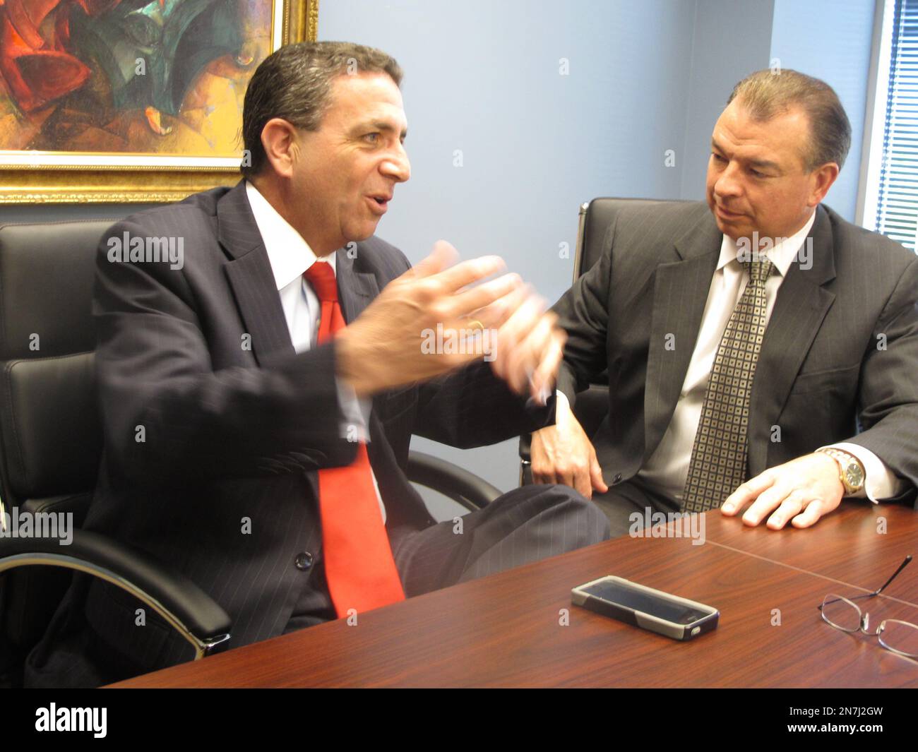 New Jersey Assemblyman Paul Moriarty speaks with his lawyer, John