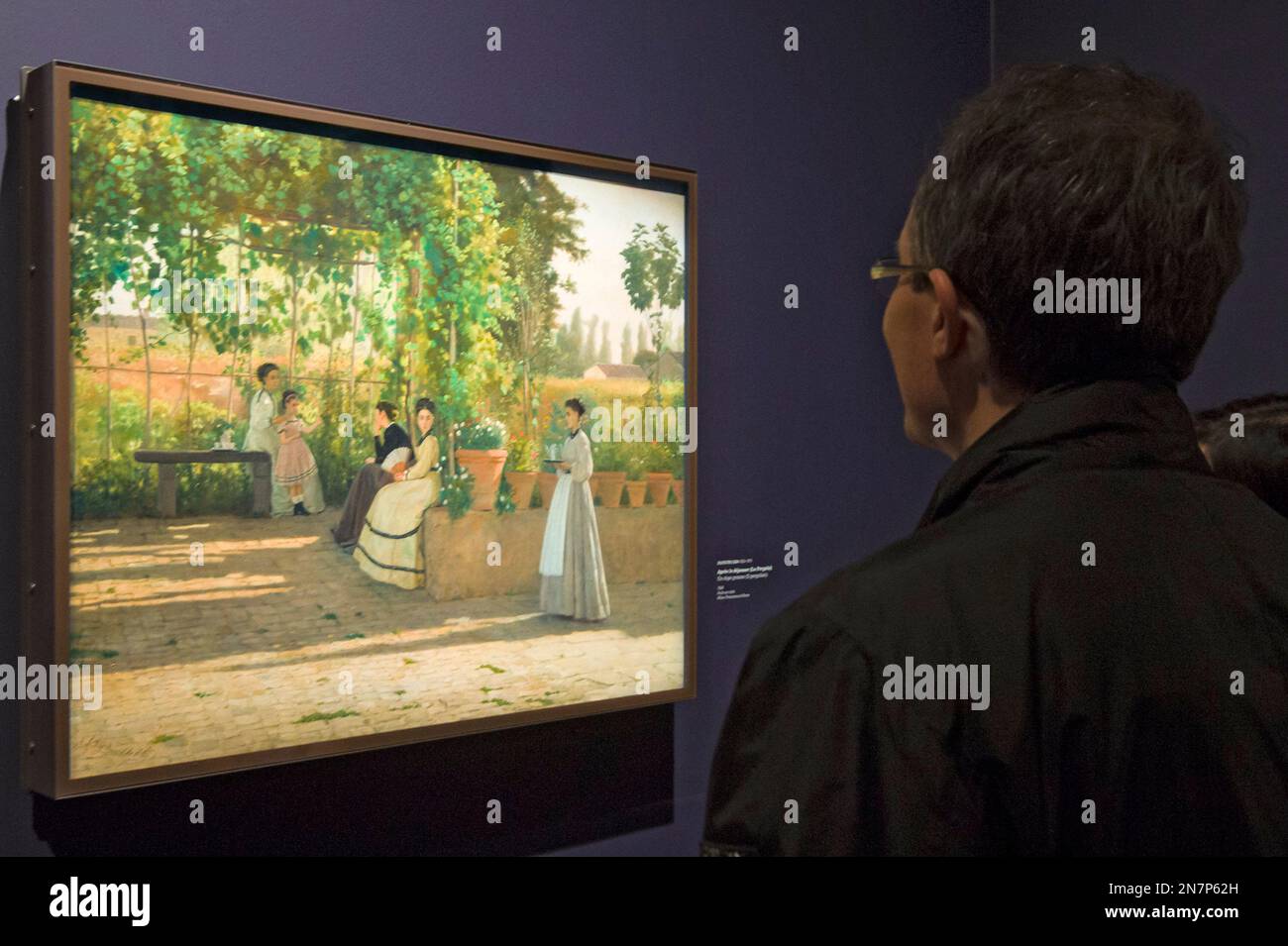 Predayed Art A visitors looks at the painting ''After Lunch