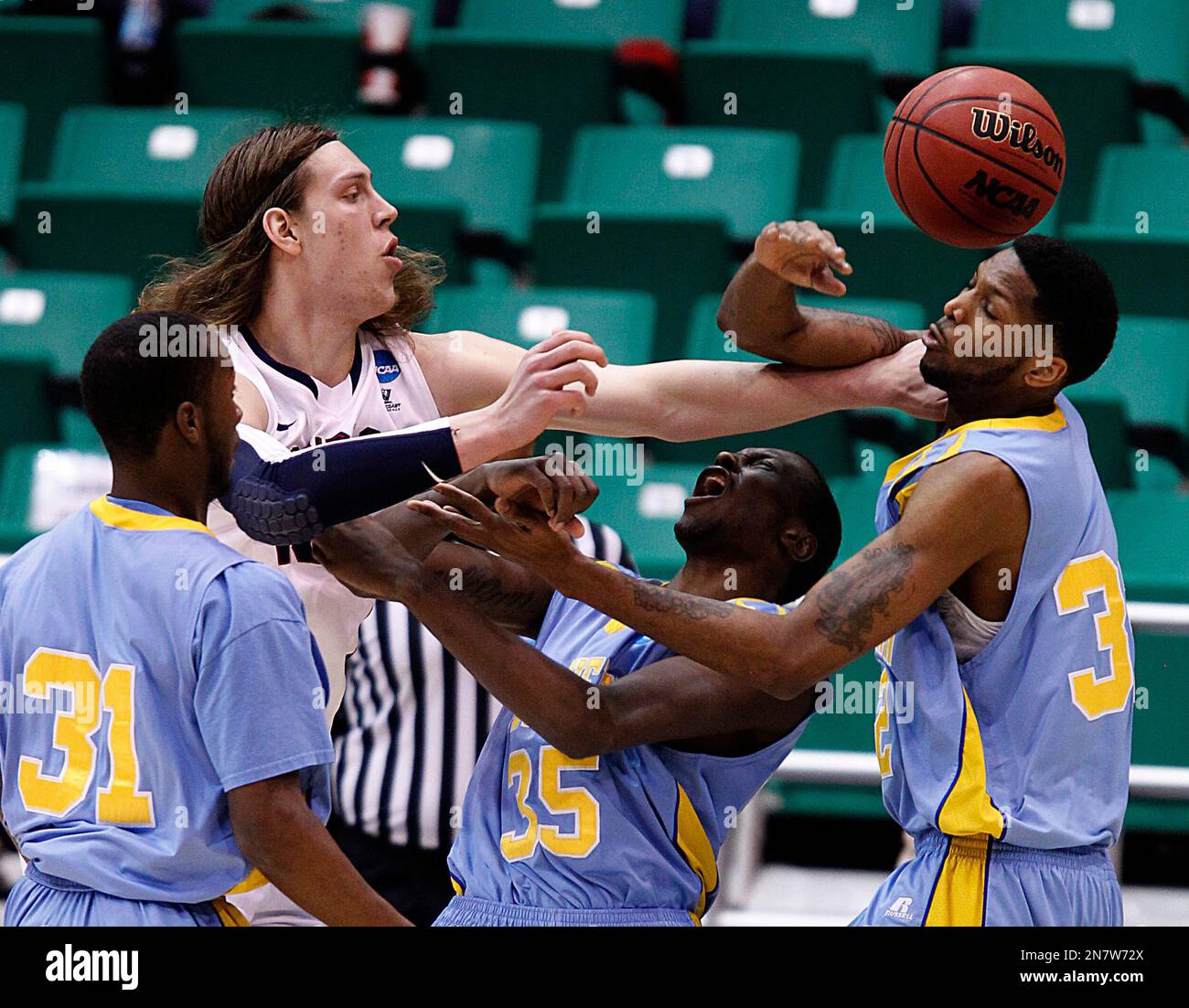 Gonzaga's Kelly Olynyk, second from left, fights for a rebound with Southern's Christopher Hyder, left, Madut Bol, second from rightm and Brandon Mioore, right, in the first half during a second-round game in the NCAA college basketball tournament in Salt Lake City, Thursday, March 21, 2013. (AP Photo/George Frey) Stockfoto