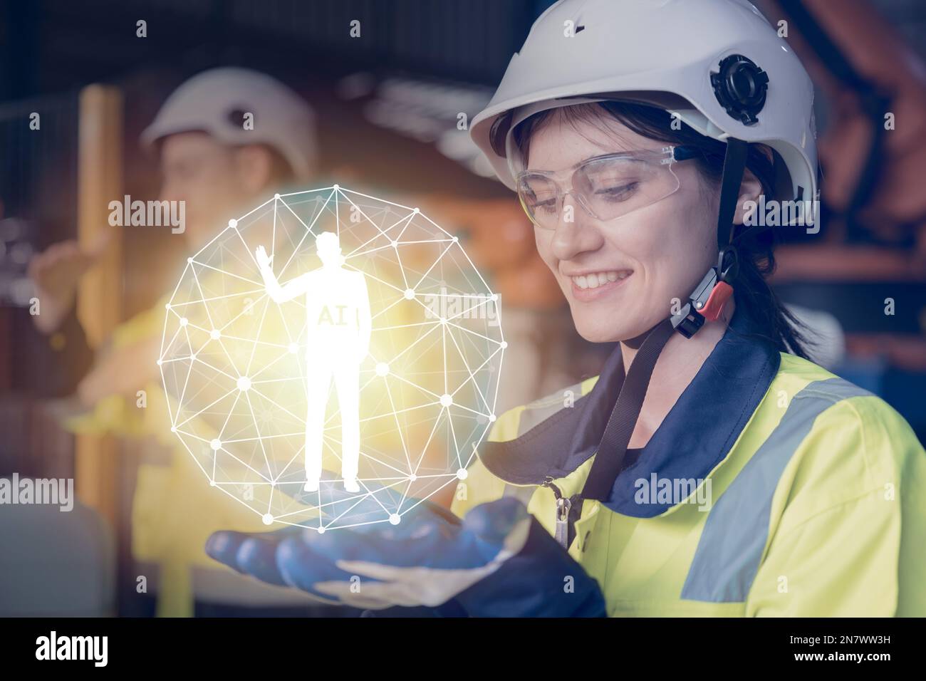 Industrieingenieur mit holografischen KI-Assistenten-Grafiken zur Hand für das Arbeitskonzept Stockfoto