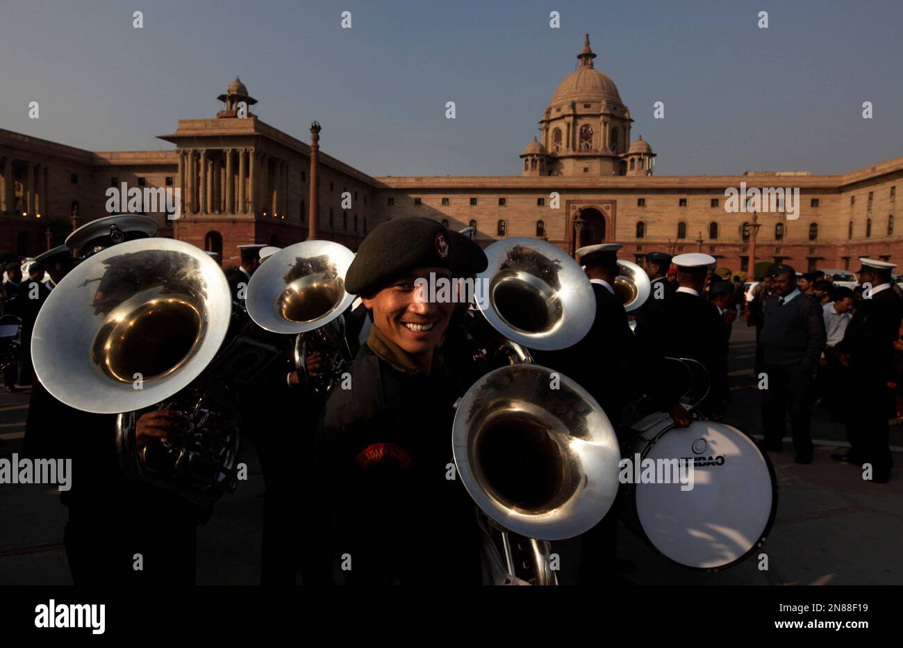 A member of Indian army band reacts to camera during rehearsals for the