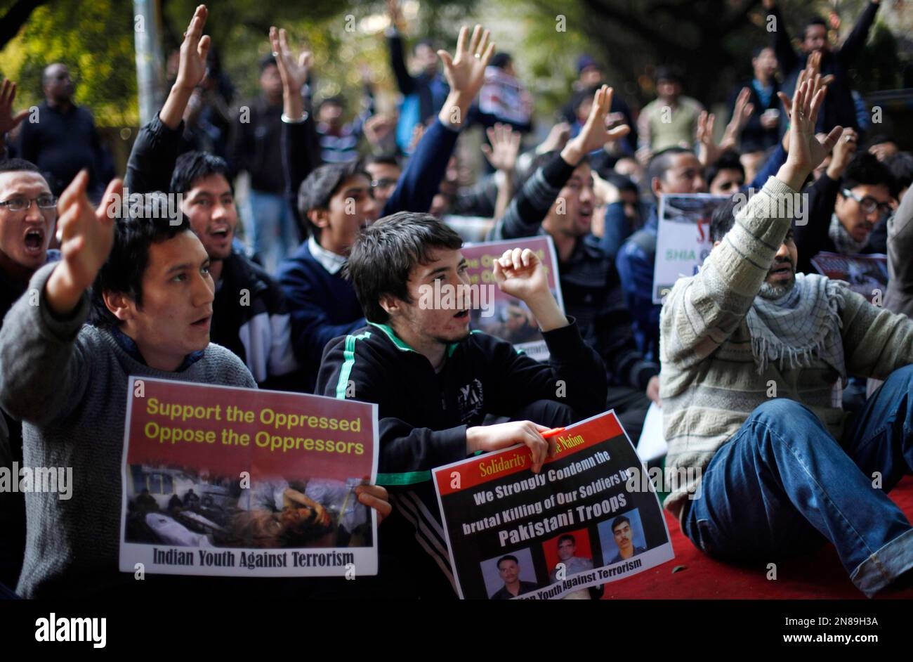 Indian Shiite Muslims hold placards as they shout slogans against the ...