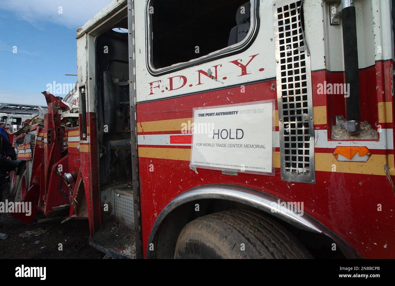 Damaged fire trucks and debris are seen from the World Trade Center attacks at the Fresh Kills