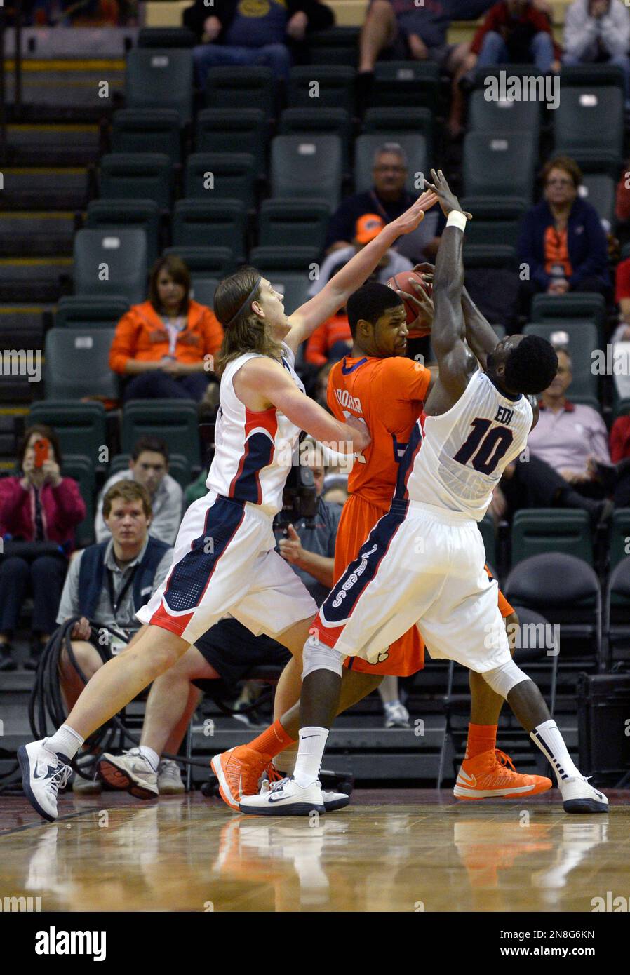 Clemson center Devin Booker, center, is trapped between Gonzaga forward
