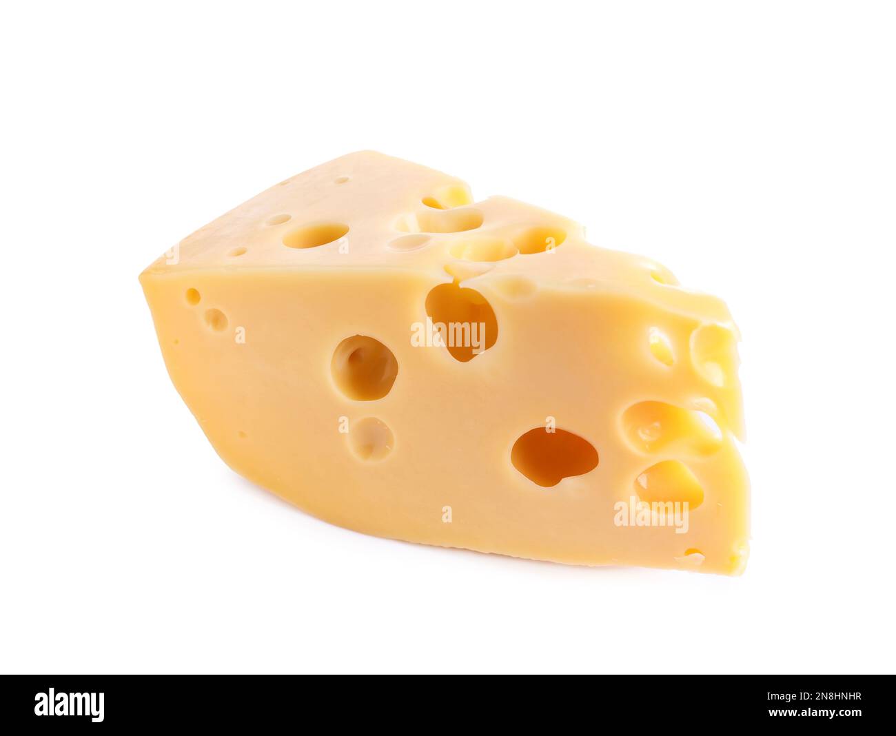 Stück Käse mit Löchern, die isoliert auf weiss Stockfoto