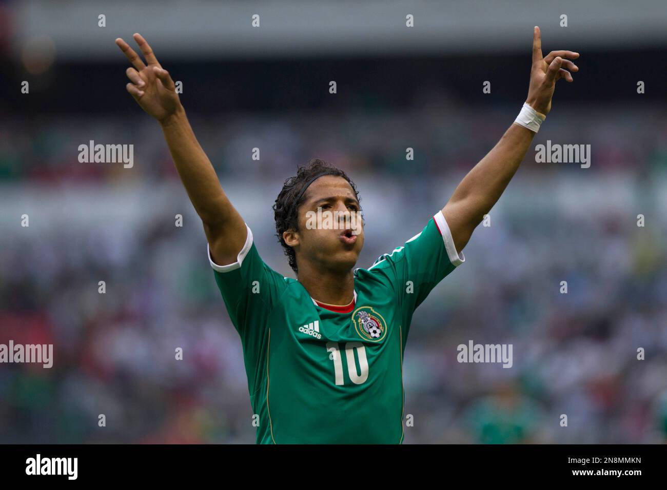 FILE - In this June 8, 2012 file photo, Mexico's Giovani Dos Santos celebrates his goal against Guyana at a World Cup qualifying soccer match in Mexico City. (AP Photo/Christian Palma, File) Stockfoto