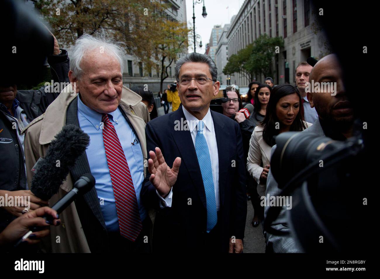 Rajat Gupta, center, leaves federal court in New York, Wednesday, Oct ...