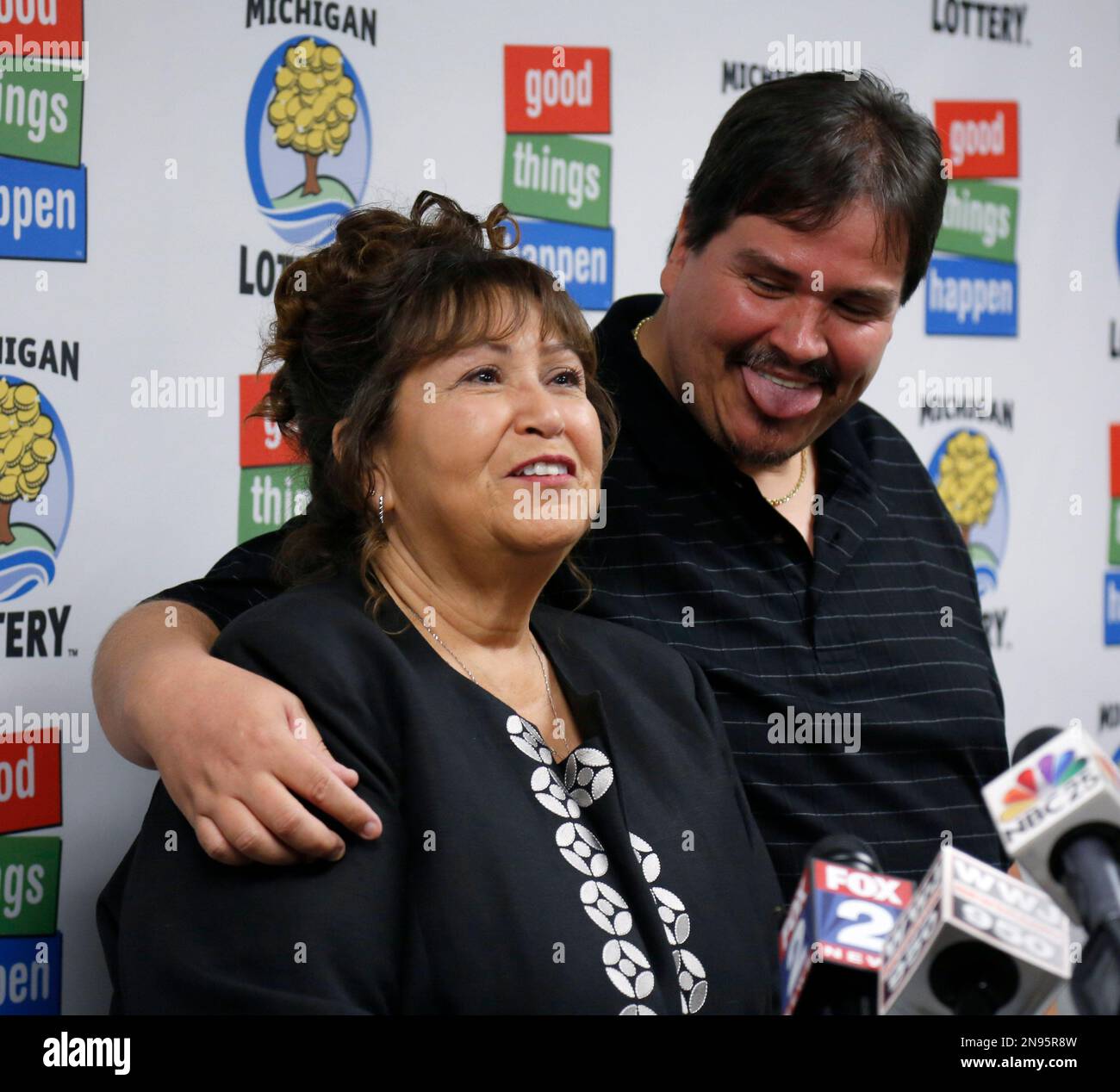 Donald Lawson, right, a 44yearold Lapeer, Mich. resident, laughs with