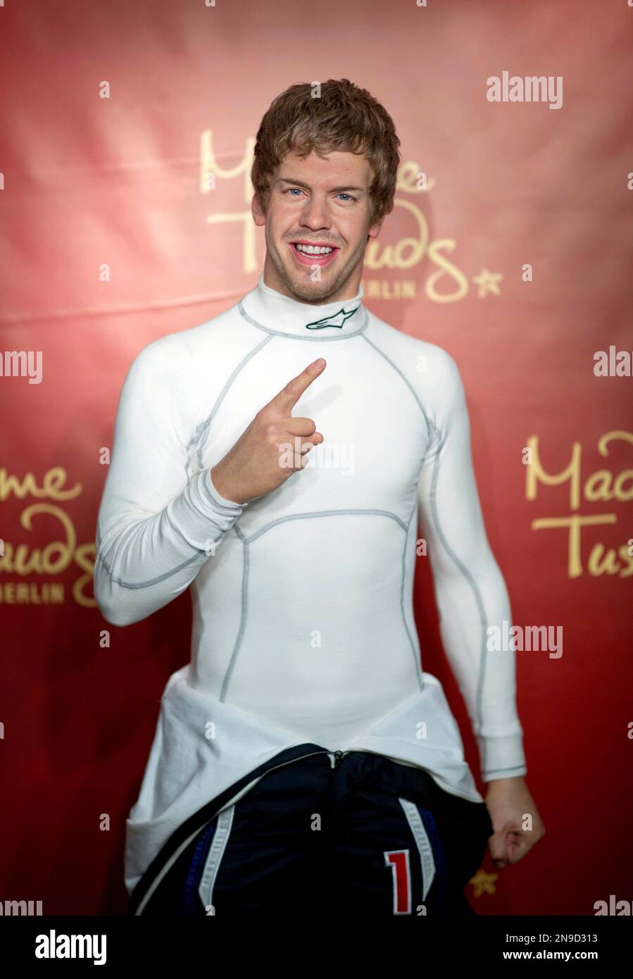 The new waxwork figure of Formula One World Champion German Sebastian Vettel is unveiled at Madame Tussauds in Berlin, Germany, Friday, July 27, 2012. (AP Photo/Gero Breloer) Stockfoto