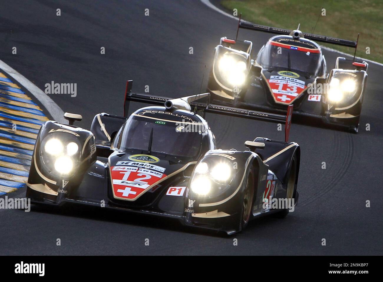 The Lola B12/60 driven by Nick Heidfeld of Germany in action ahead of the Lola n°13 during the 80th 24-hour Le Mans endurance race, in Le Mans, western France, Saturday, June 16, 2012. (AP Photo/David Vincent) Stockfoto