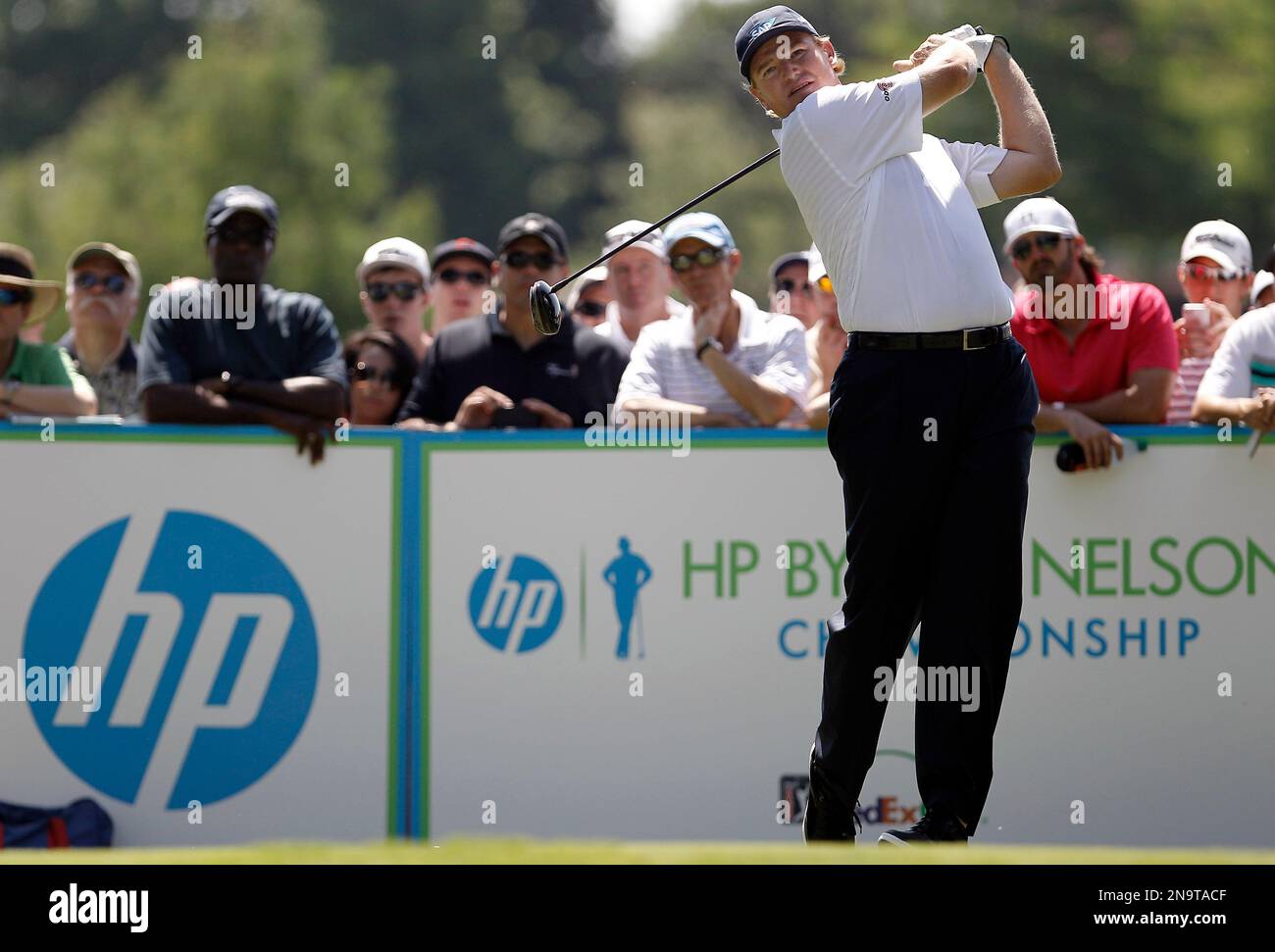 Ernie Els watches his shot from the seventh tee box during the first round of the PGA Byron Nelson Championship golf tournament on Thursday, May 17, 2012, in Irving, Texas. (AP Photo/Brandon Wade) Stockfoto