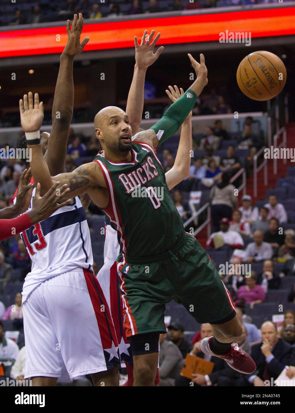 Milwaukee Bucks power forward Drew Gooden (0) is fouled by Washington Wizards forward Kevin Seraphin (13) during the first half of an NBA basketball game in Washington, Wednesday, April 18, 2012. (AP Photo/Manuel Balce Ceneta) Stockfoto
