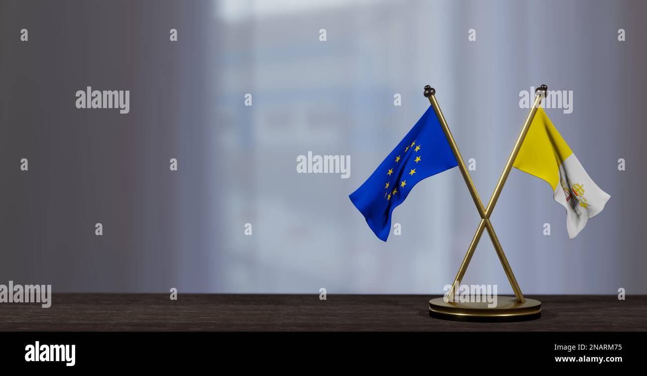 Vatikanstadt und Europafahnen liegen auf dem Tisch. Verhandlungen zwischen Vatikanstadt und der EU. Auf wenig unscharfem Hintergrund. 3D Arbeit und 3D Bild Stockfoto