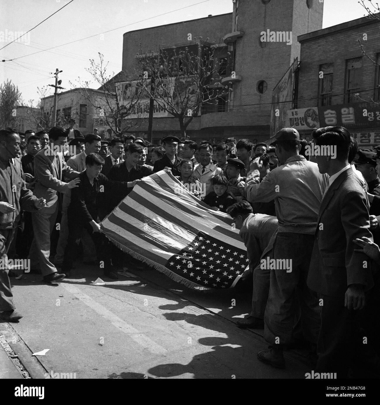 Students demonstrating in Seoul, South Korea carefully fold large ...