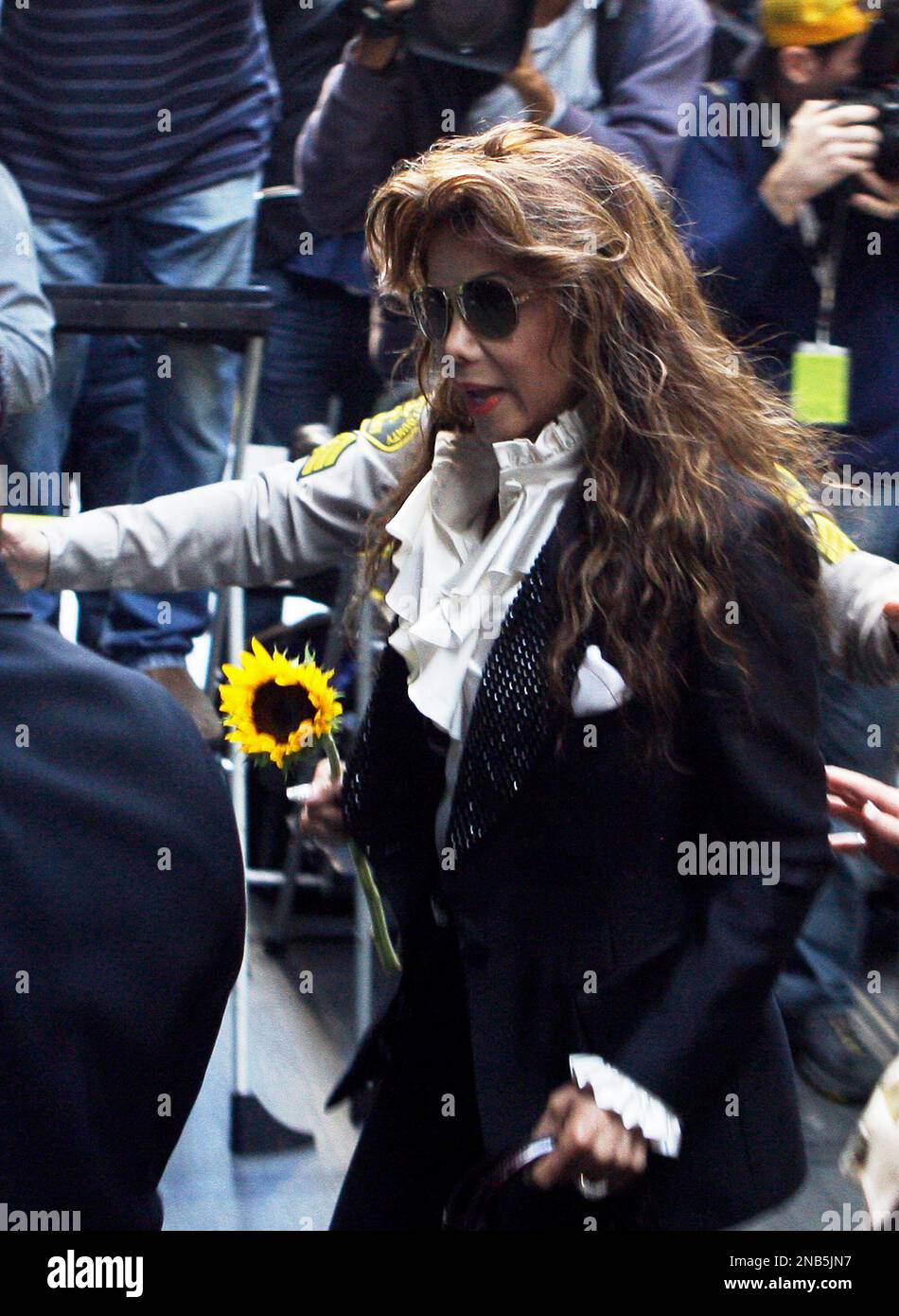 Holding a sunflower given her by a fan, Michael Jackson's sister Latoya