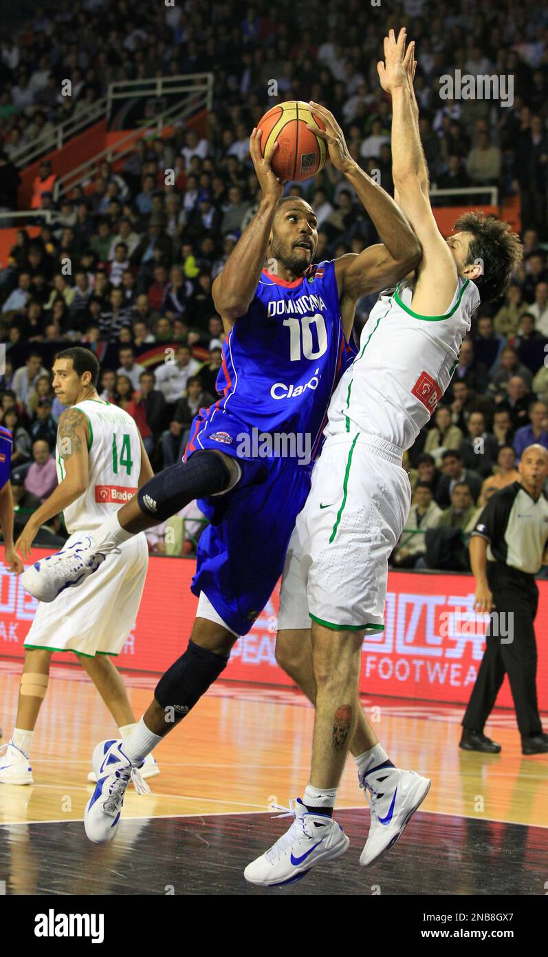 Dominican Republic's Alfredo Horford, left, goes to the basket against Brazil's Guilherme