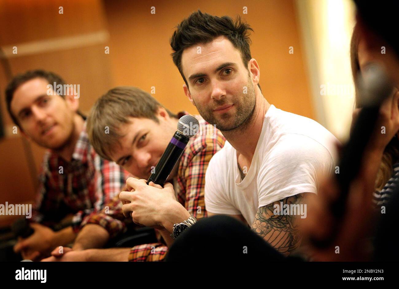 Members of american rock band maroon 5 lead singer adam levine right