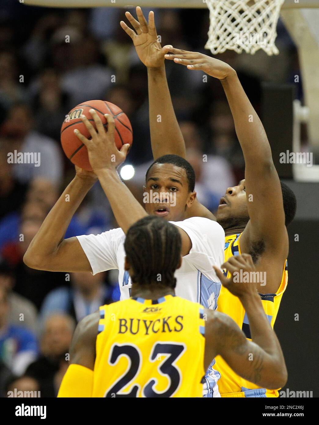 North Carolina's Dexter Strickland (1) passes theball away from