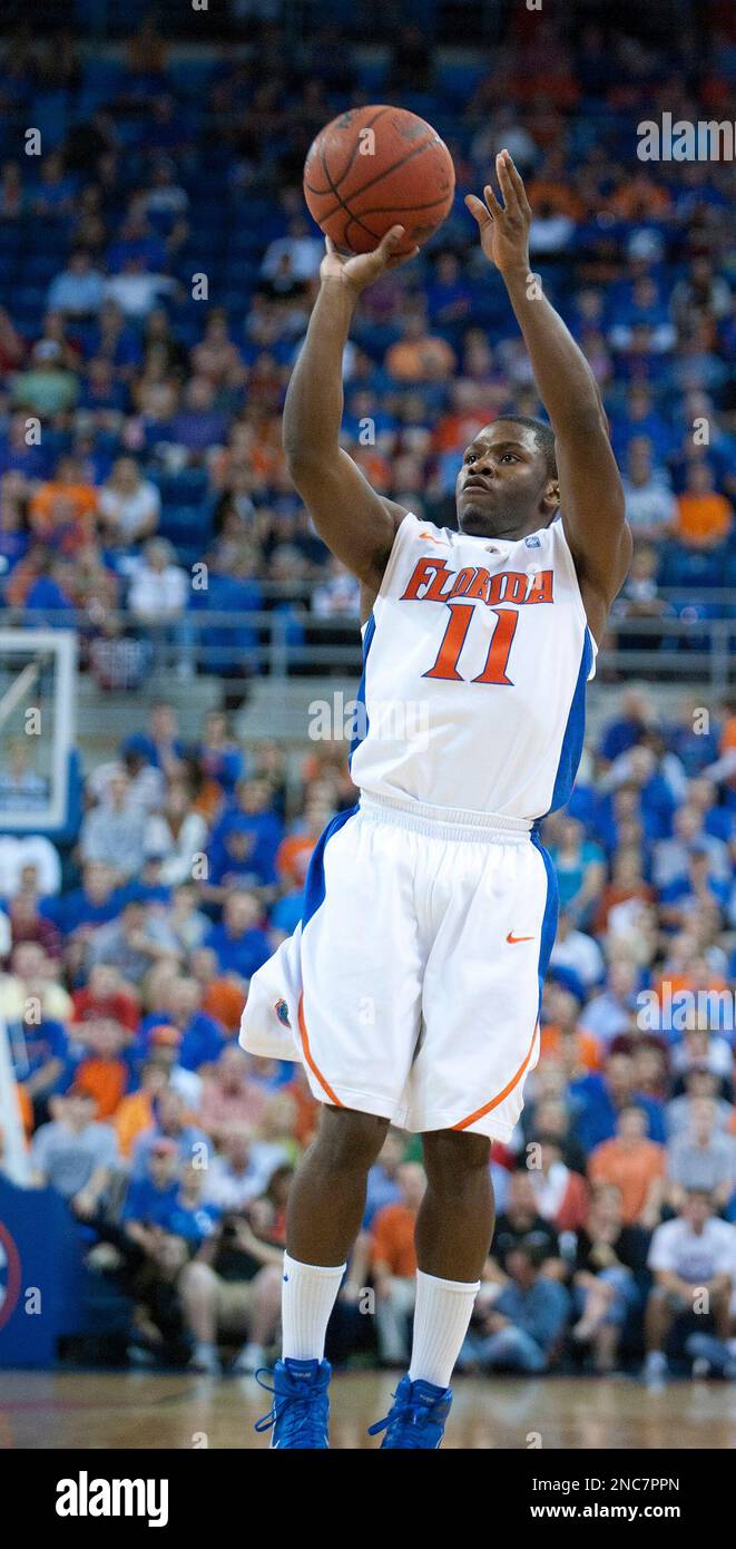 Florida's Erving Walker (11) shoots a three pointer against
