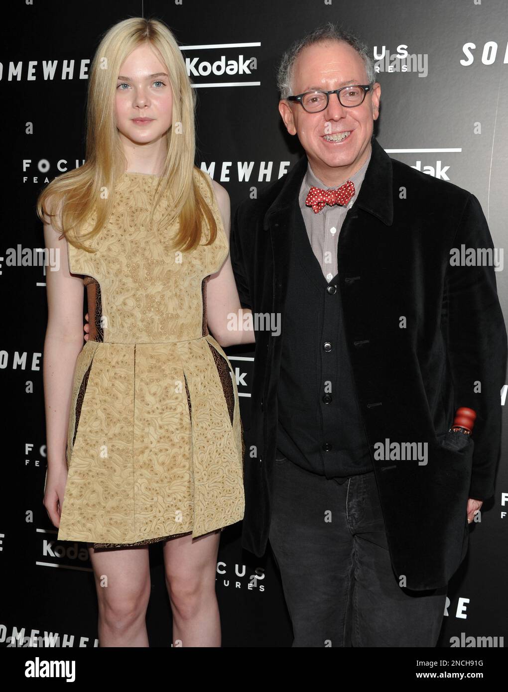 Actress Elle Fanning, left, and Focus Features' James Schamus attend the premiere of 'Somewhere' at the Tribeca Grand Hotel on Sunday, Dec. 12, 2010 in New York. (AP Photo/Evan Agostini) Stockfoto