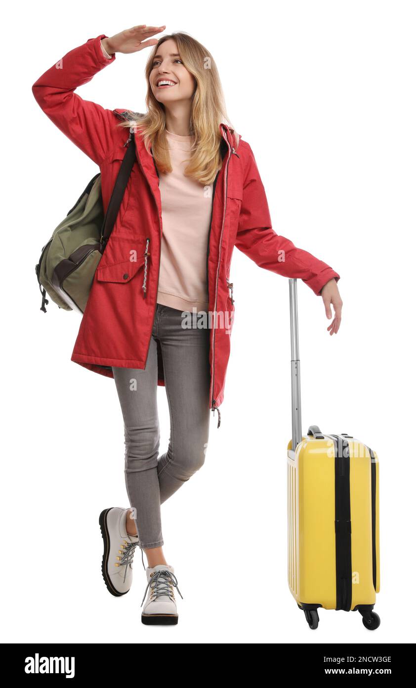 Frau mit Koffer läuft auf weißem Hintergrund. Winterreisen Stockfoto