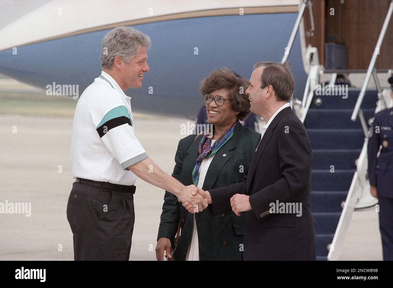 President bill clinton shakes hands with white house chief of staff