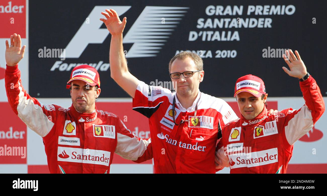 From left, Ferrari driver Fernando Alonso of Spain, the winner of the race, Ferrari team principal Stefano Domenicali and third placed Ferrari driver Felipe Massa of Brazil celebrate on the podium after the Italian Formula One Grand Prix at the Monza racetrack in Monza, Italy, Sunday, Sept. 12, 2010. (AP Photo/Alberto Pellaschiar) Stockfoto