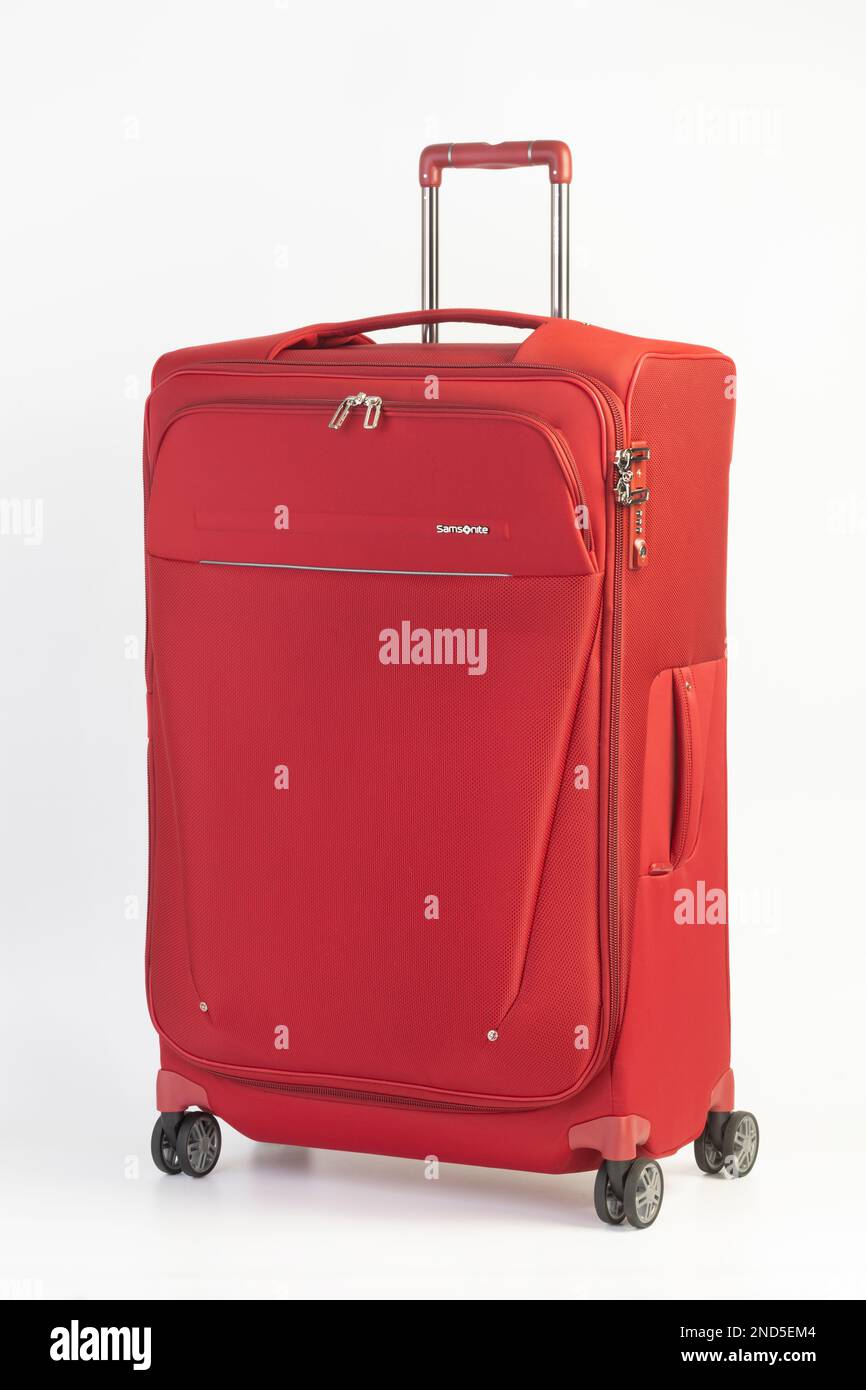 Ein roter, leichter Samsonite-Koffer. Stockfoto