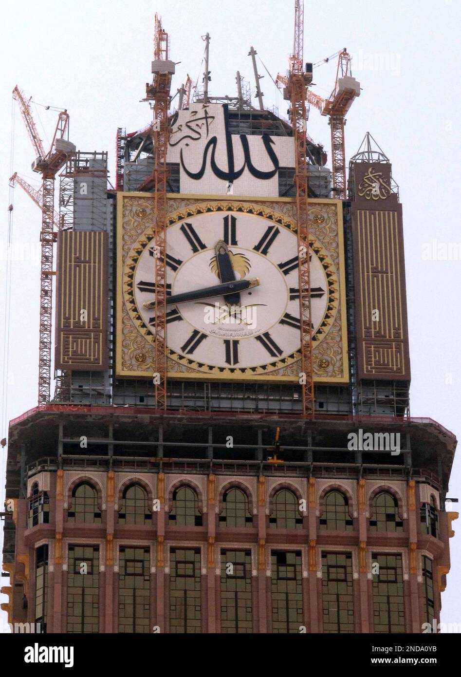 a-four-faced-clock-atop-the-abraj-al-bait-towers-is-seen-under