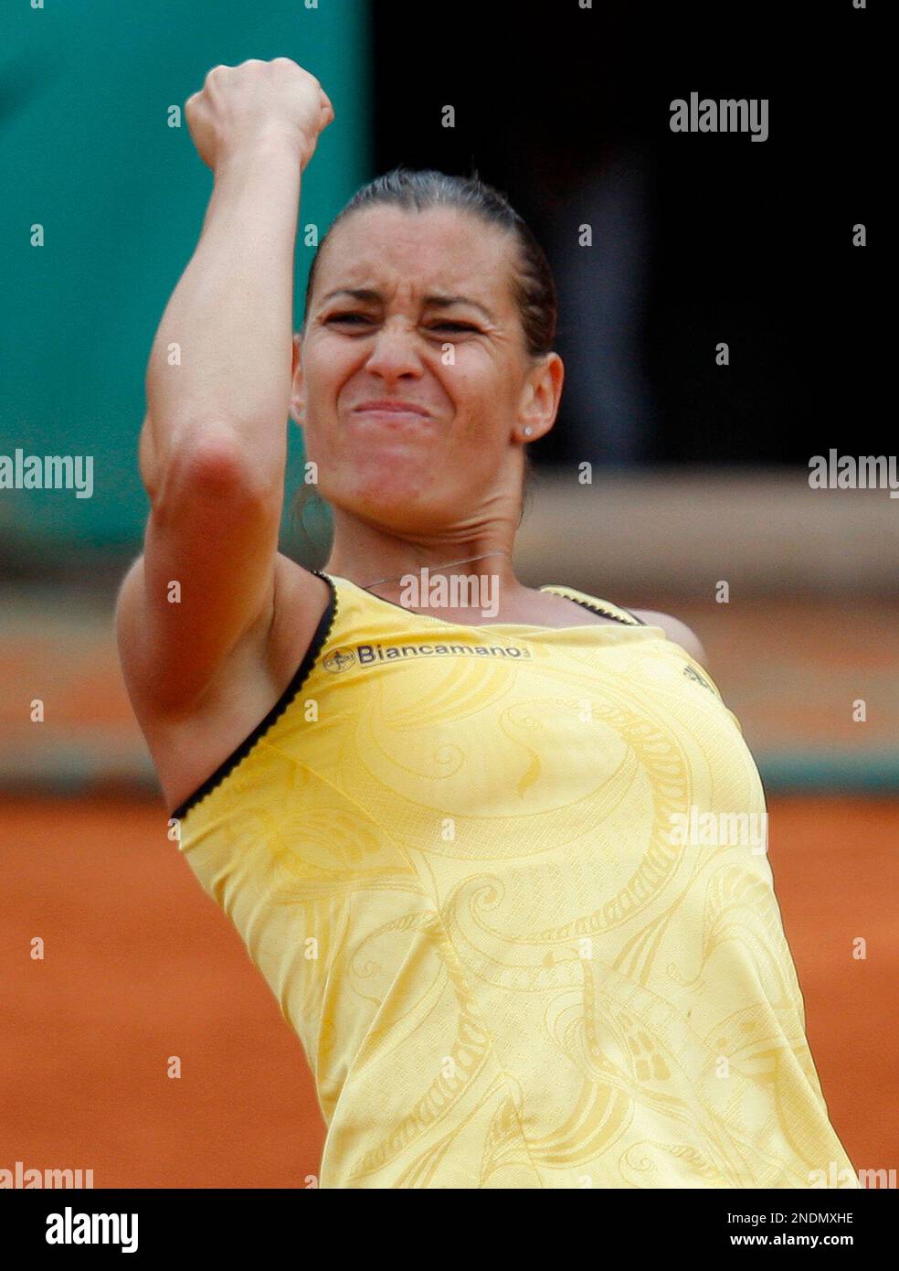 Italy's Flavia Pennetta reacts as she plays Denmark's Caroline