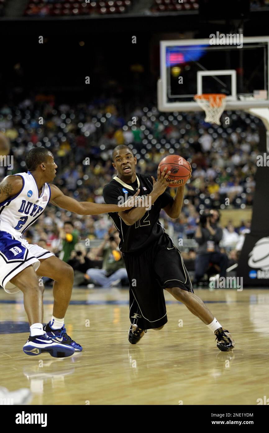 Purdue's Kelsey Barlow drives against Duke's Nolan Smith during the first half of an NCAA South Regional semifinal college basketball game in Houston, Friday, March 26, 2010. (AP Photo/Eric Gay) Stockfoto