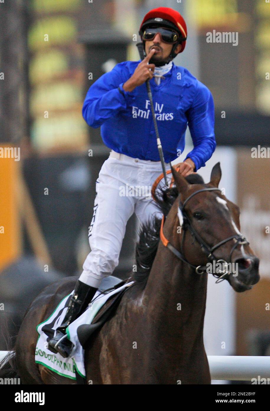 Calming Influence from Ireland ridden by Ahmad Ajtebi wins the Godolphin Mile of Dubai World Cup at Meydan horse race track in Dubai, United Arab Emirates, Saturday March 27, 2010. (AP Photo/Kamran Jebreili) Stockfoto