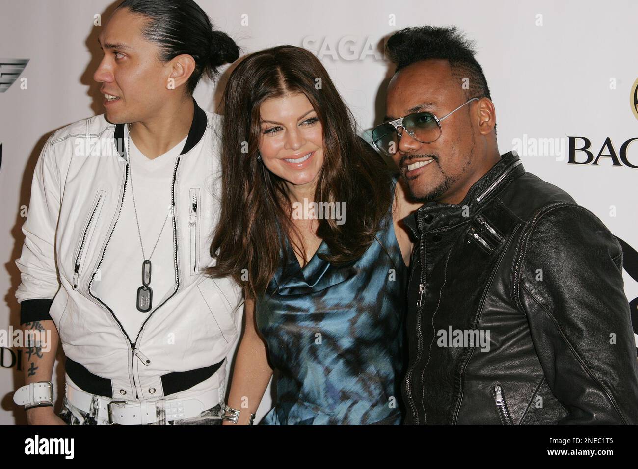 Black Eyed Peas members Taboo (L) Fergie and apl.de.ap (R) arrive for the Playboy party during Super Bowl festivities in Miami Beach, Florida, Saturday, February 6, 2009. (AP Photo/Carlo Allegri) Stockfoto