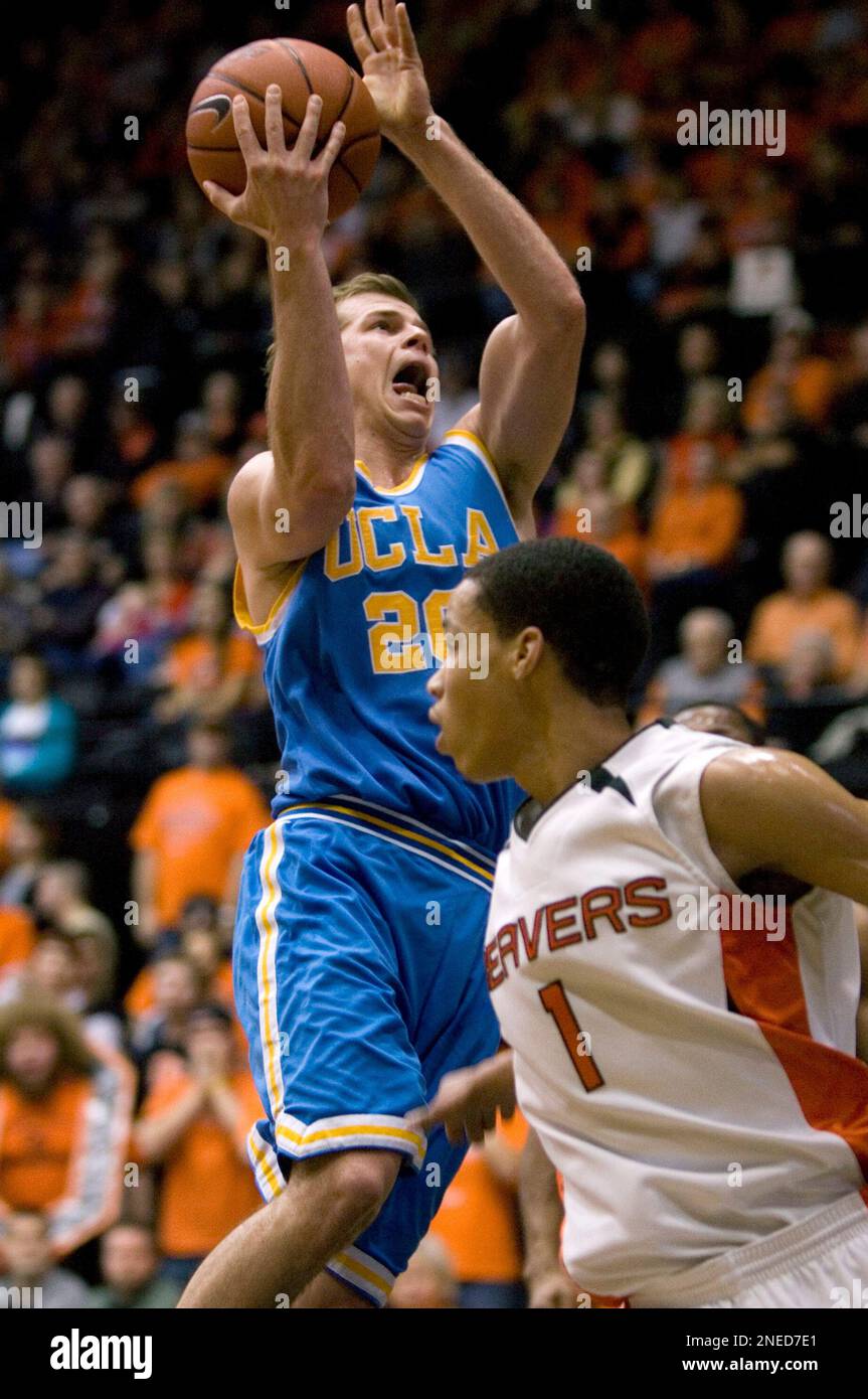 UCLA guard Michael Roll, left, goes to the hoop past Oregon State guard