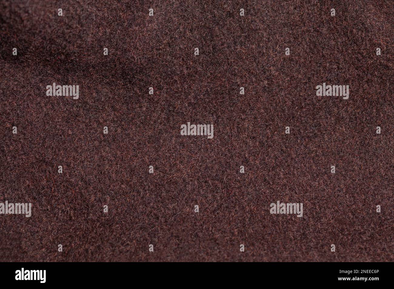 Konsistenz brauner Wollgewebe. Material für warme Winterkleidung. Stockfoto