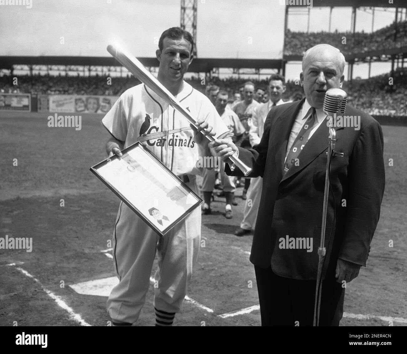 stan-musial-cardinal-s-slugging-outfielder-receives-silver-bat-from