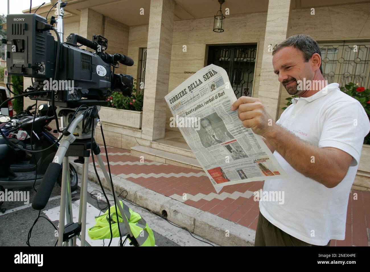 Journalists and media crews are seen in front of a crematorium in Monte
