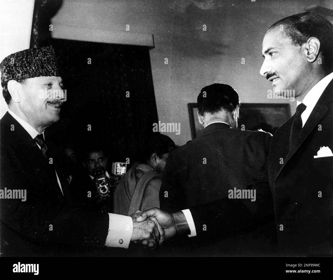 President Mohammed Ayub Khan of Pakistan, left, shakes hands with one ...