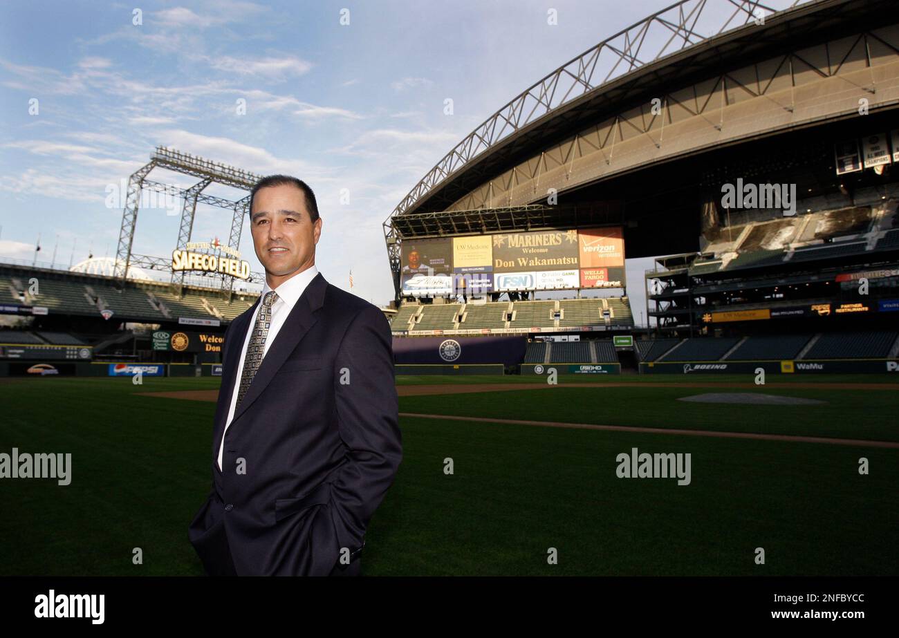 New Seattle Mariners manager Don Wakamatsu poses on the team's field following a news conference
