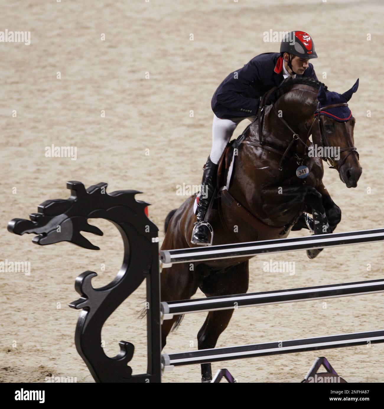 Hong Kong rider Patrick Lam with his horse Urban competes during the first qualifying round for the Equestrian Show Jumping competition during the Beijing 2008 Olympics in Hong Kong, Friday, Aug. 15, 2008. (AP Photo/Kin Cheung) Stockfoto