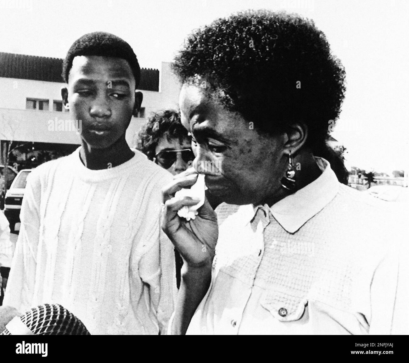 A tearful Rennie Mandela-Perry speaks briefly to the press after the ...