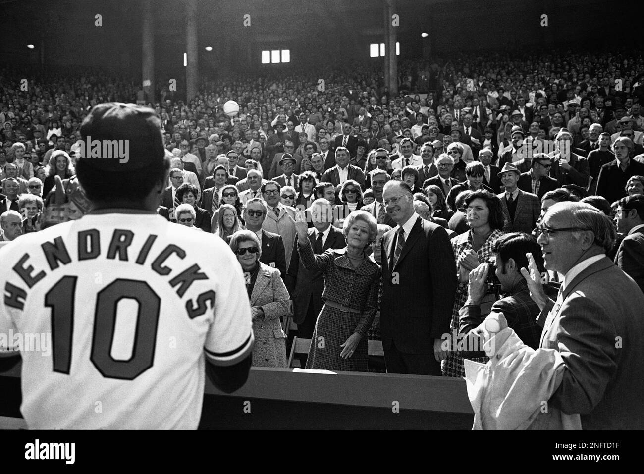 Mrs. Pat Nixon, wife of the President Richard Nixon, throws out first