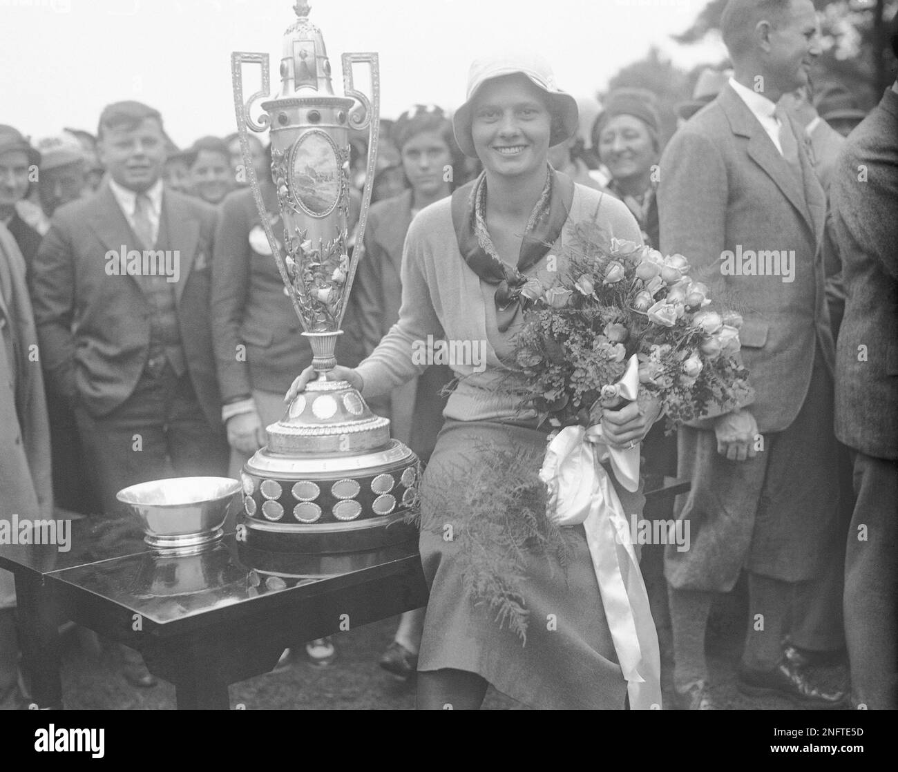 Virginia Van Wie of Chicago is shown with her trophy after she defeated