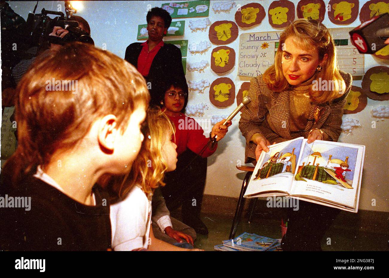 Hillary Rodham Clinton, wife of Democratic presidential hopeful Bill clinton,  reads the book "There's An Alligator Under My Bed" to Delois Cunningham's  kindergarten class at Public School 31 in Buffalo, N.Y., April