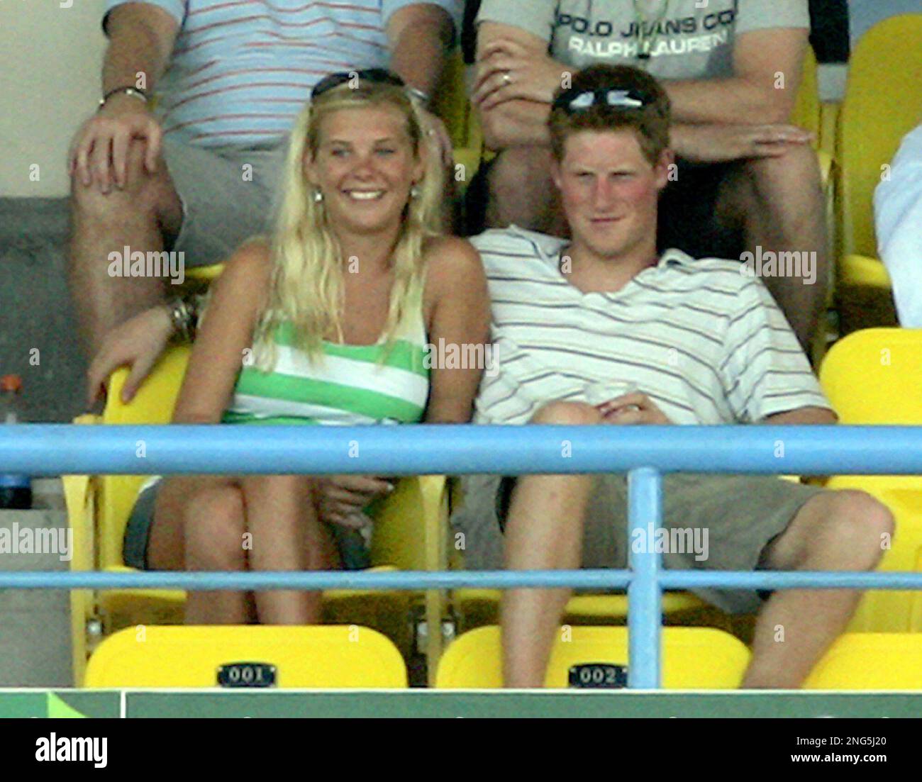 Britain's Prince Harry, right, sits with his girlfriend Chelsy Davy as they attend the Cricket World Cup Super 8s match between England and Australia at the Sir Vivian Richards Stadium in St Peter's, Antigua, Sunday April 8, 2007. (AP Photo/Matt Dunham) Stockfoto