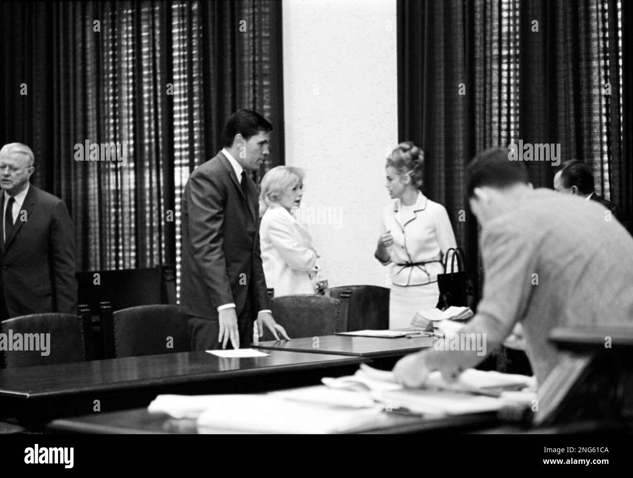 Candace Mossler and her nephew, Melvin Lane Powers, talk with Attorney