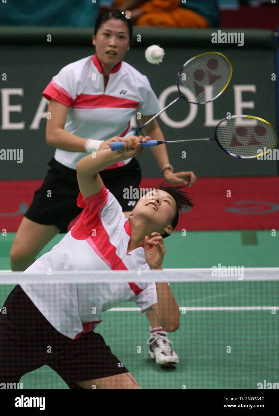 China's Gao Ling, top, looks on as Huang Sui returns the shuttlecock