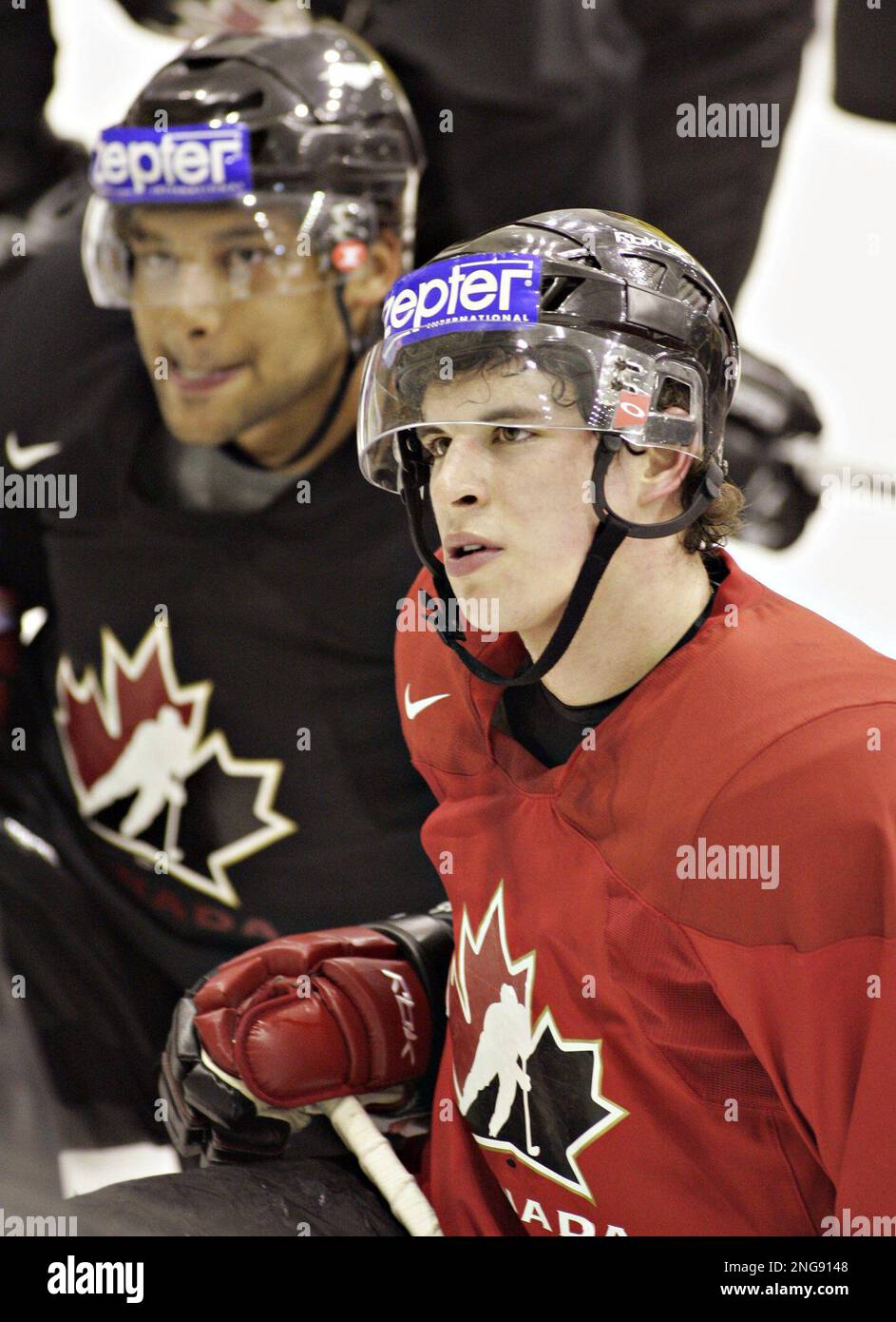 Team Canada's Sidney Crosby, right, congratulates teammate Patrice Bergeron  who scored Canada's fourth goal in the first period against Latvia at the  IIHF World Hockey Championship, Thursday, May 11, 2006, in Riga